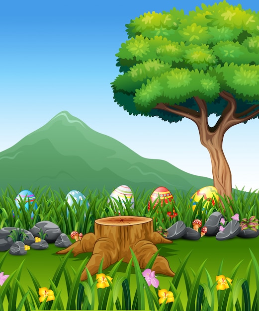 Huevos de pascua coloridos en hierba verde con paisaje hermoso