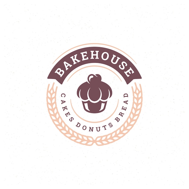 Vector insignia de panadería o etiqueta ilustración retro cupcake y siluetas de trigo para panadería.