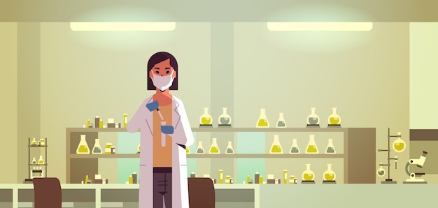 investigador científico femenino con tubo de ensayo