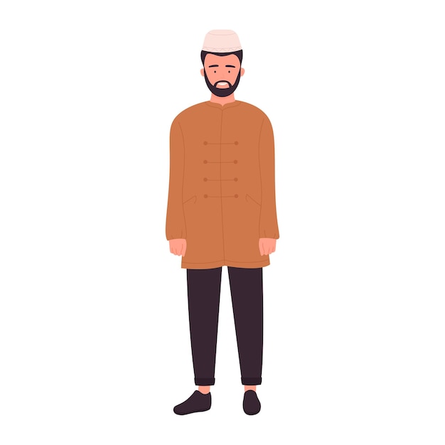 Joven musulmán con barba de pie con kurta y gorra
