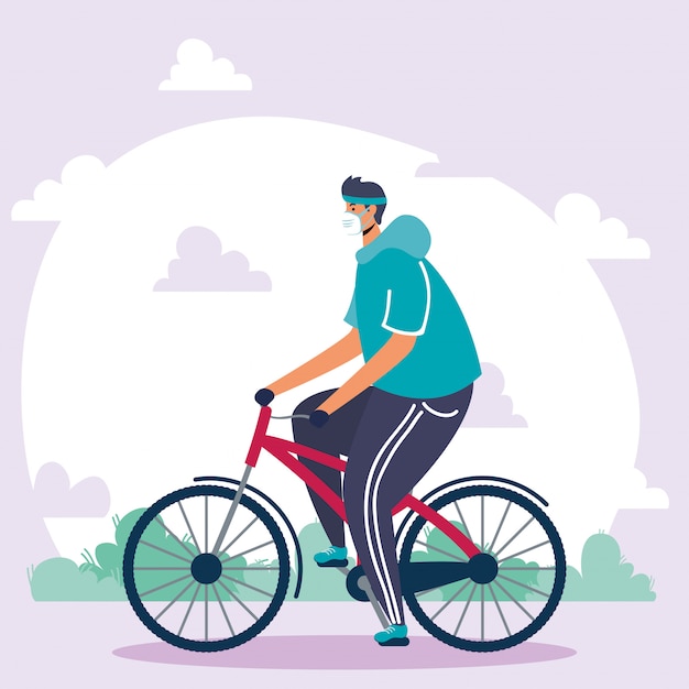 Joven vistiendo máscara médica en bicicleta
