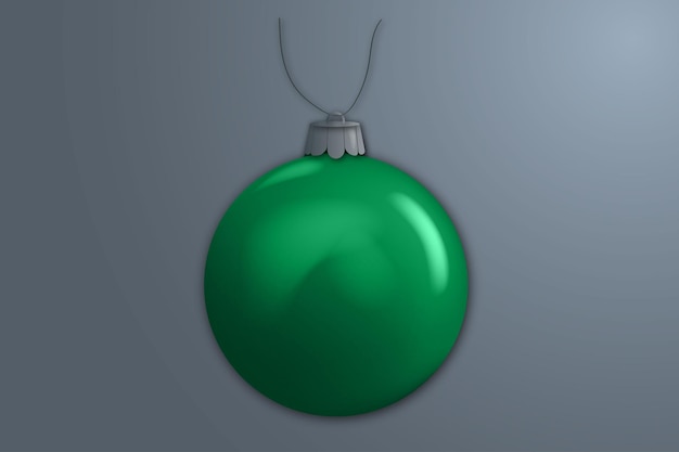 juguete verde en una cuerda para el árbol de Navidad