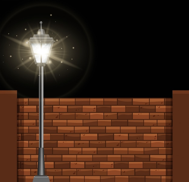 Vector lamp post y brickwall en la noche