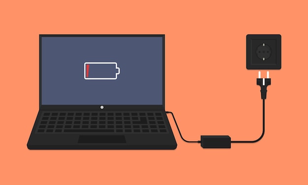Laptop con adaptador de alimentación de alerta de batería baja y enchufe de pared