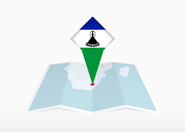 Lesoto está representado en un mapa de papel doblado y un marcador de ubicación fijado con la bandera de Lesoto.