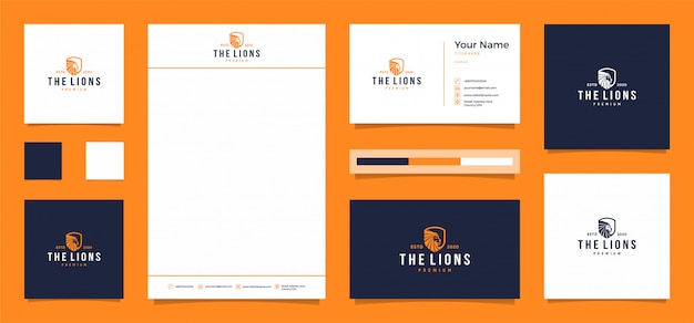 el logo del león con una tarjeta de presentación y membrete