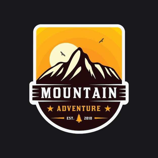 El logotipo del emblema de la aventura de montaña