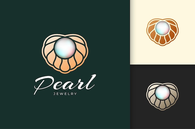 El logotipo de perlas de lujo y con clase con concha o vieira representa joyas y gemas