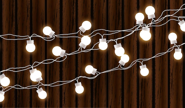 Luces de Navidad aisladas sobre fondo de madera oscura Guirnalda de resplandor Bombillas de Navidad de resplandor vectorial en cables