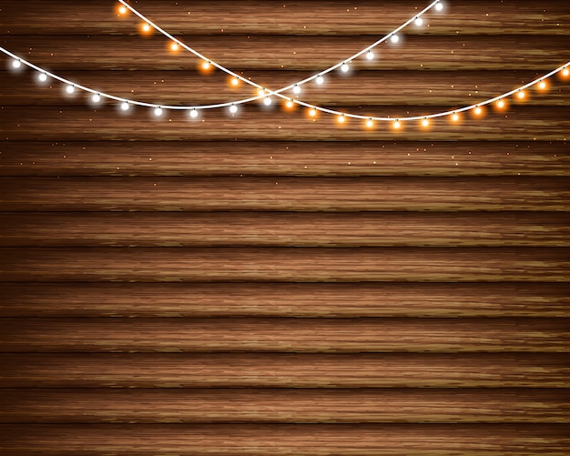 Vector luces de navidad en el fondo de madera