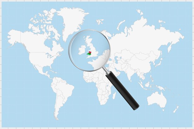 Vector lupa que muestra un mapa de gales en un mapa del mundo