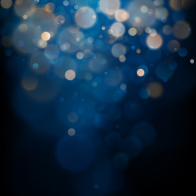 Luz bokeh borrosa sobre fondo azul oscuro. Vacaciones de navidad y año nuevo. Brillo abstracto desenfocado de estrellas parpadeantes y chispas.