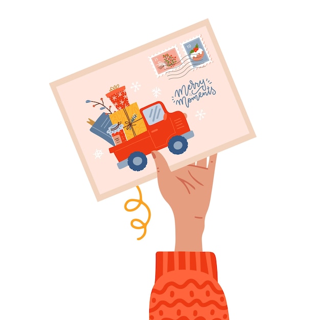 Mano femenina sosteniendo postal con sello de navidad y momentos felices letras texto con camioneta pickup ...