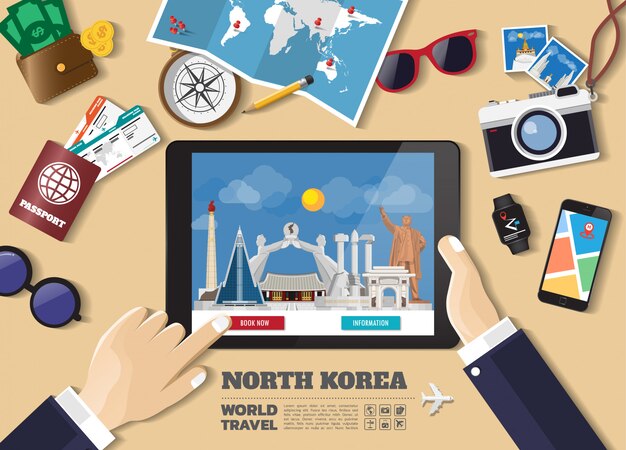 Mano que sostiene el destino de viaje de reserva de tableta inteligente. Lugares famosos de Corea del Norte.
