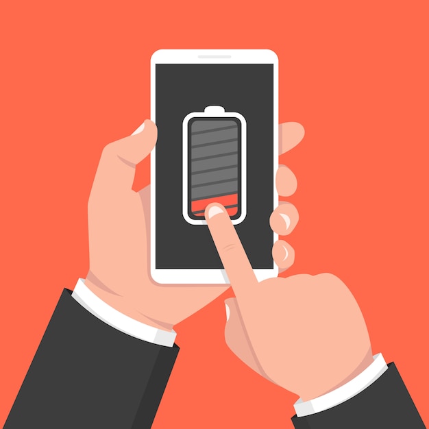 Mano que sostiene el teléfono inteligente con batería baja