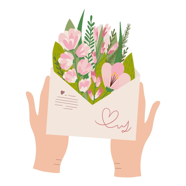 Mano con un ramo de flores de primavera en un sobre postal