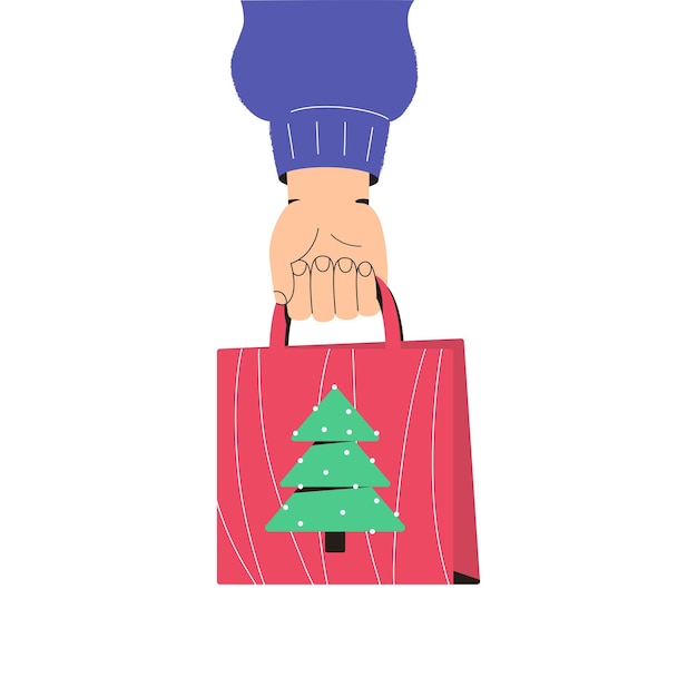 Mano sostiene un paquete de regalo de Navidad Compras navideñas Saludos navideños