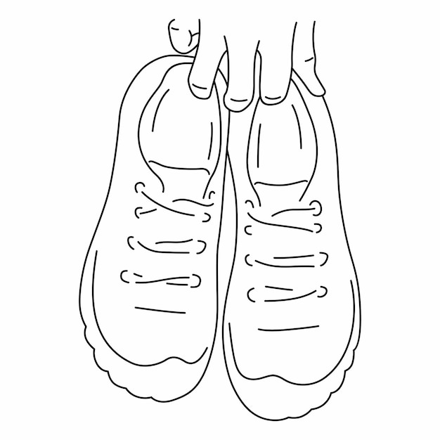 La mano sostiene un par de zapatillas deportivas