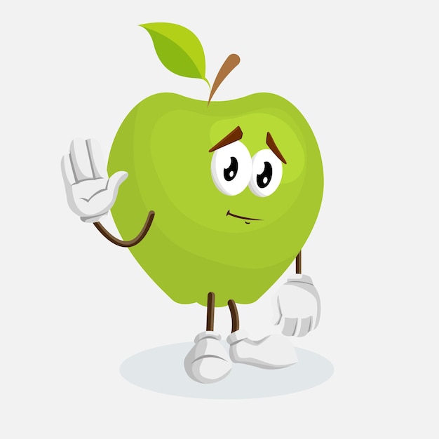 una manzana verde con una cara que dice manzana