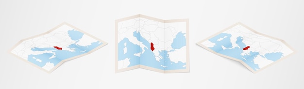 Mapa doblado de albania en tres versiones diferentes.