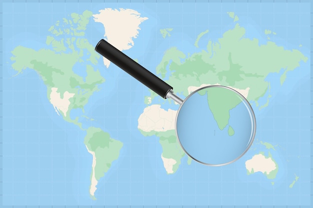 Mapa del mundo con una lupa en un mapa de maldivas.