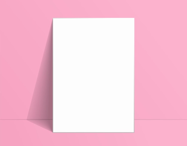 Maqueta de póster blanco de pie en el suelo cerca de la pared rosa maqueta de lienzo en blanco para el diseño