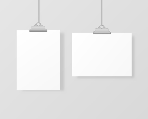Marcos de fotos colgantes en blanco o plantillas de carteles aislados en el fondo. Un conjunto de póster blanco colgado en una carpeta en la pared. Marco para una hoja de papel.