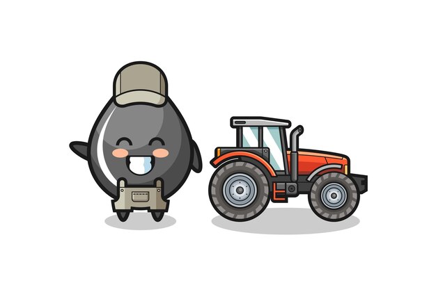 La mascota del granjero de la gota de aceite de pie junto a un diseño lindo del tractor