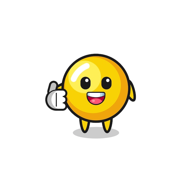 Mascota de yema de huevo haciendo gesto de pulgar hacia arriba