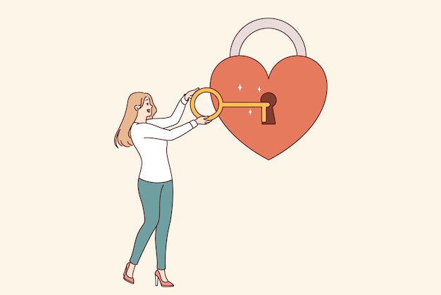 La mujer abre un corazón en forma de candado con una llave que simboliza la bondad y la empatía o el amor
