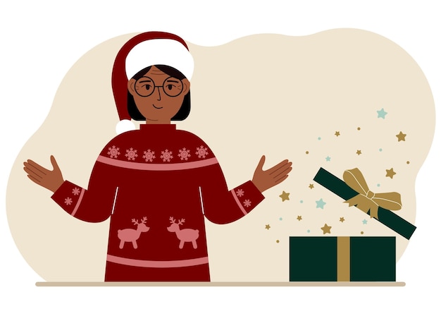 Una mujer cerca de un regalo abierto de Navidad o Año Nuevo Caja de regalo para las vacaciones de invierno