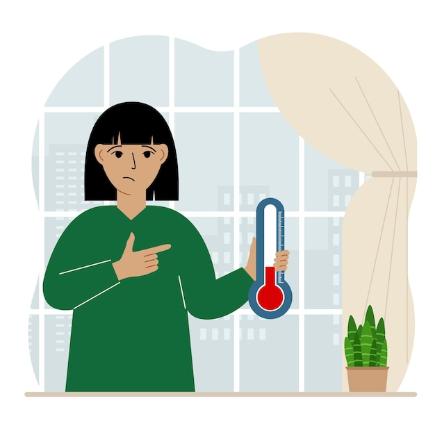 Una mujer cerca de la ventana con un dispositivo para medir la temperatura en la habitación.