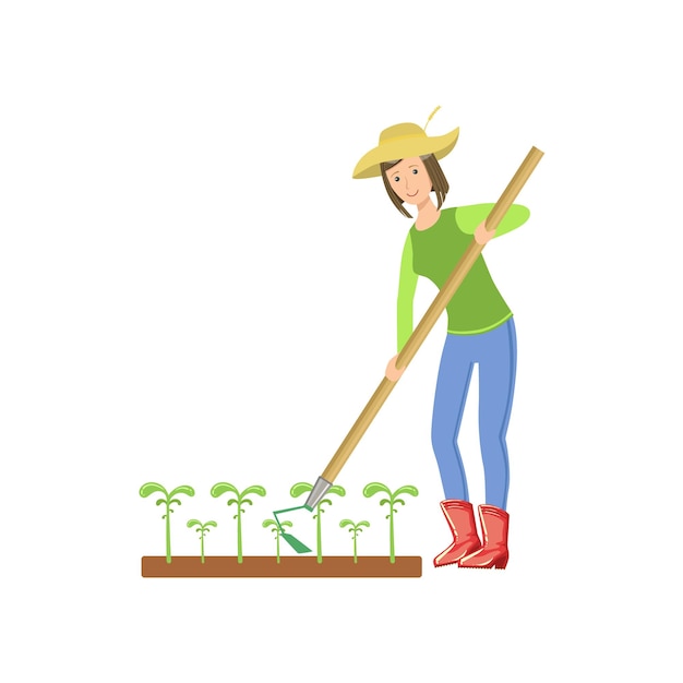 Mujer cortando el suelo alrededor de los cultivos