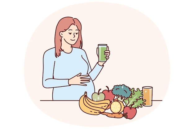 Mujer embarazada bebe jugo de frutas y verduras frescas de pie cerca de acero con alimentos saludables