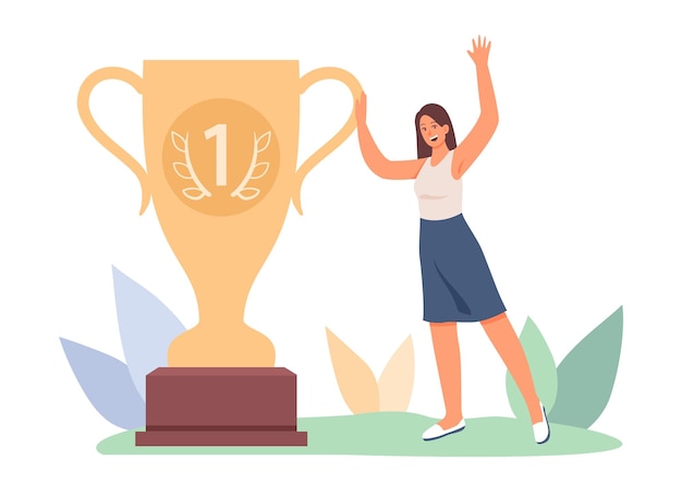 Una mujer feliz se regocija parada cerca de una gran copa de oro