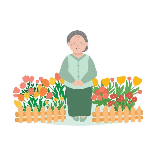 Una mujer se para frente a un macizo de flores con tulipanes al fondo.