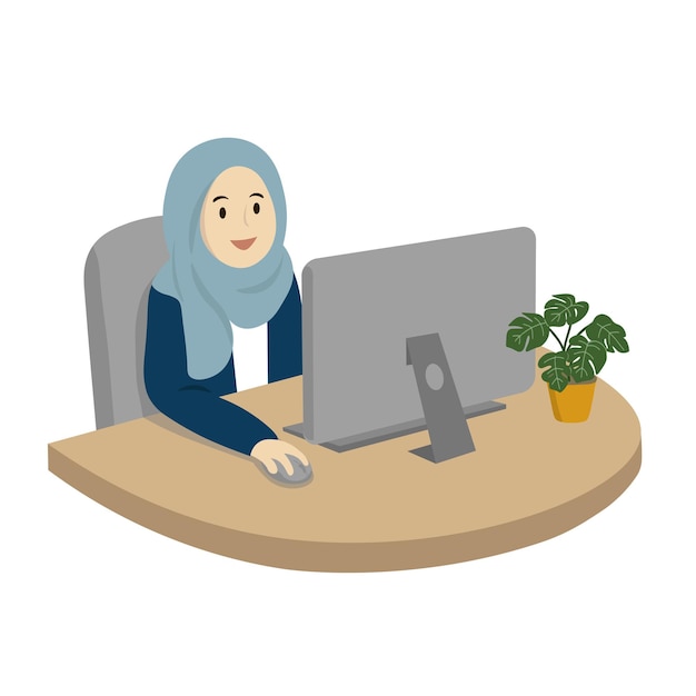 Una mujer con hijab se sienta frente a una computadora y lleva un hijab