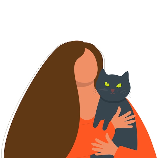 La mujer joven está sosteniendo un gato en sus manos