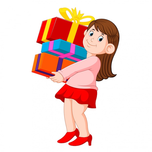 Mujer joven feliz que sostiene la pila de regalos