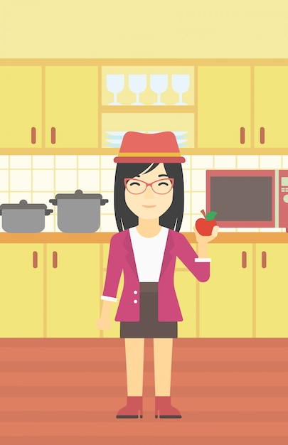 Vector mujer joven con manzana en la cocina.