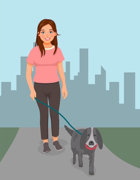 Mujer joven paseando al perro en el parque