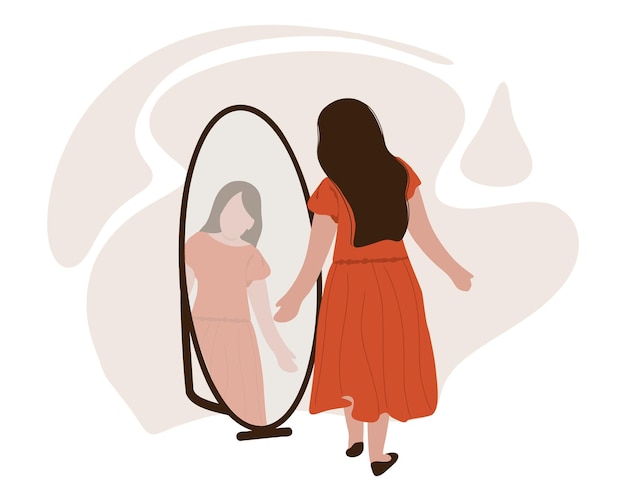 Una mujer joven con un vestido rojo se mira en el espejo. Reflejo en el espejo.