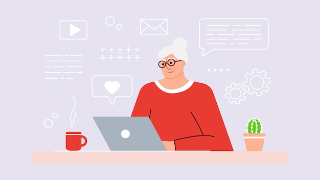 Mujer mayor estudia y estudia tecnologías modernas usando una computadora portátil. Una abuela sonriente positiva se sienta frente a una computadora, se comunica en Internet en línea y aprende cosas nuevas. Un adulto está trabajando.