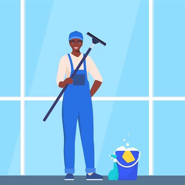 Mujer negra en uniforme azul y amarillo limpiando la ventana con raspador de vidrio y spray de lavado