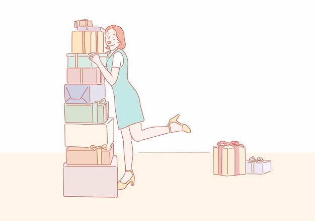 Una mujer de pie junto a una pila de regalos.