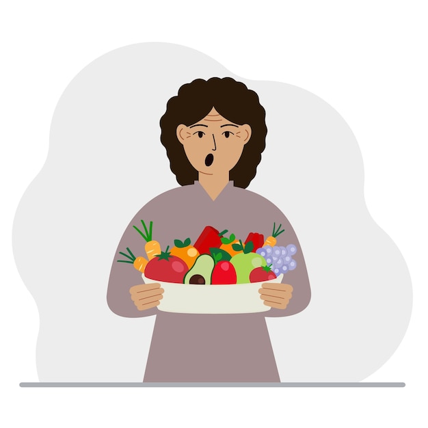 Una mujer con un plato grande de alimentos orgánicos saludables verduras y frutas el concepto de alimentos saludables estilo de vida saludable vegetarianismo agricultura