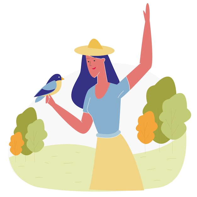 Mujer que pasa tiempo en el parque de animales alimentando aves