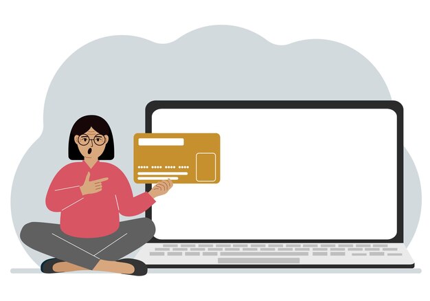 Una mujer se sienta con las piernas cruzadas y sostiene una tarjeta de plástico grande Junto a la mujer hay una computadora portátil grande con espacio para texto