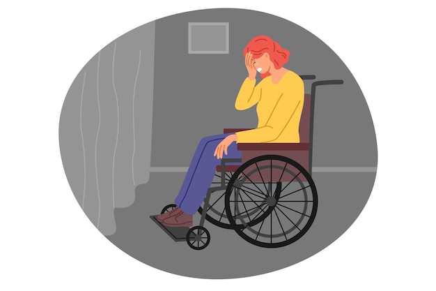 Mujer se sienta en silla de ruedas y llora estando sola cerca de la ventana sintiéndose inferior y abandonada