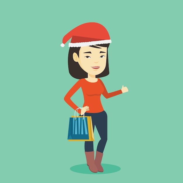 Mujer con sombrero de santa compras para regalos de navidad.